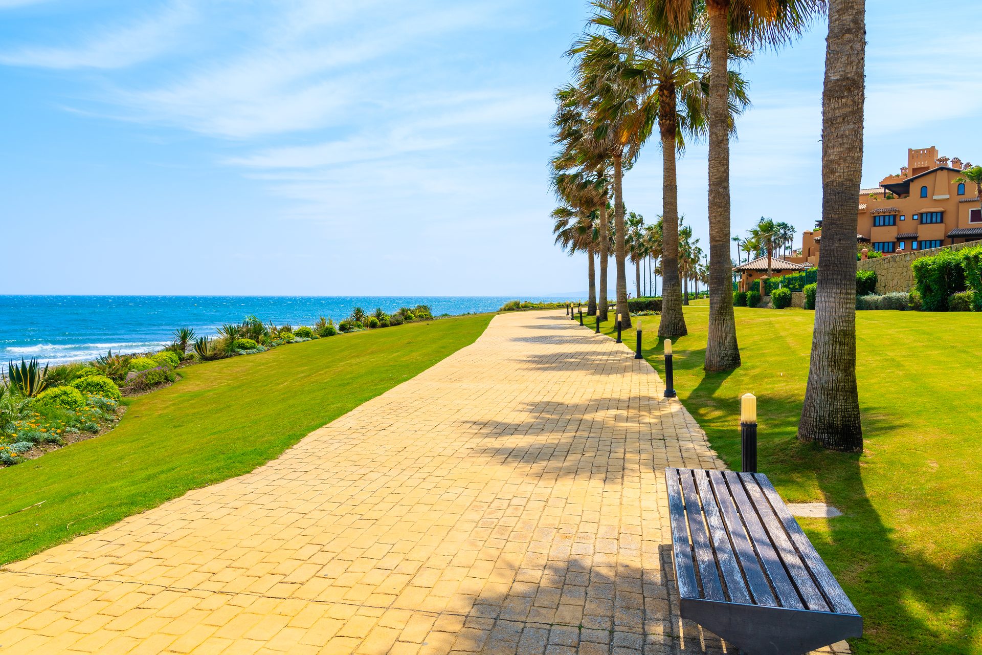 Cozy room with ocean view, featuring a balcony, comfortable seating, and a private beach access.